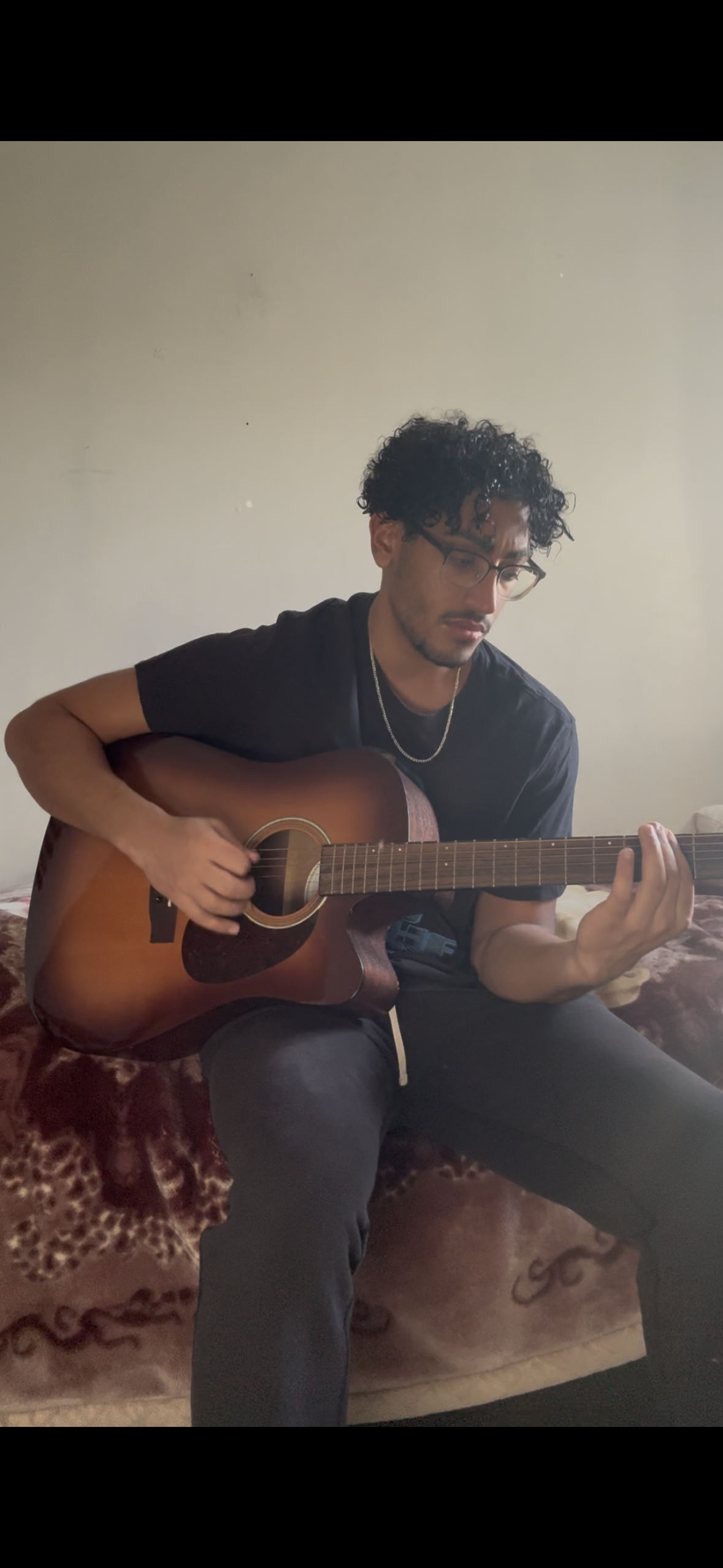 Ehab playing guitar